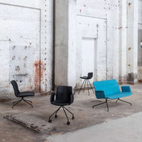 "Set of four chairs featuring sleek black and vibrant turquoise colors with modern, minimalist designs."
