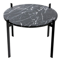 Round black marble side table with white veining and black metal legs, showcasing a modern stylish design.