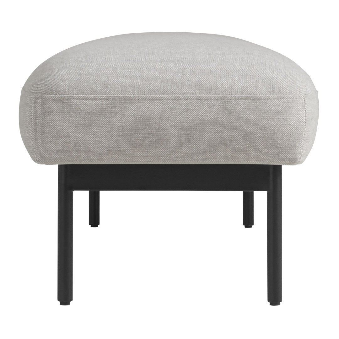 Light gray upholstered ottoman with a smooth texture and sleek black metal legs. Perfect for modern interiors.