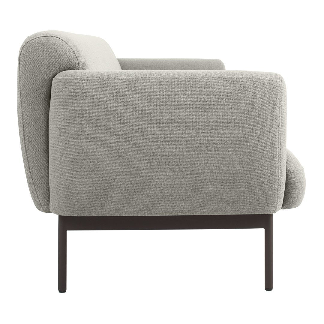 Gray upholstered sofa with sleek, modern lines and subtle textured fabric. Elegant dark metal legs for contemporary style.