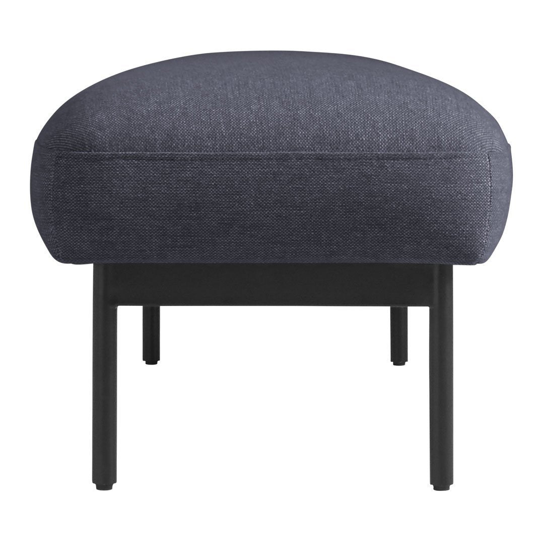 Dark blue upholstered ottoman with a subtle textured pattern and sleek black metal legs. Perfect for modern decor.