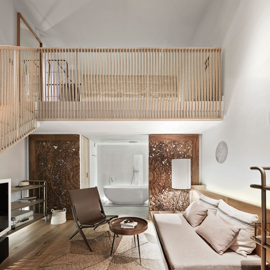Modern interior with light wood accents, neutral tones, and earthy textures, featuring a minimalist design.