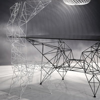 Sleek black and white geometric desk with intricate wireframe design and modern minimalist aesthetics.