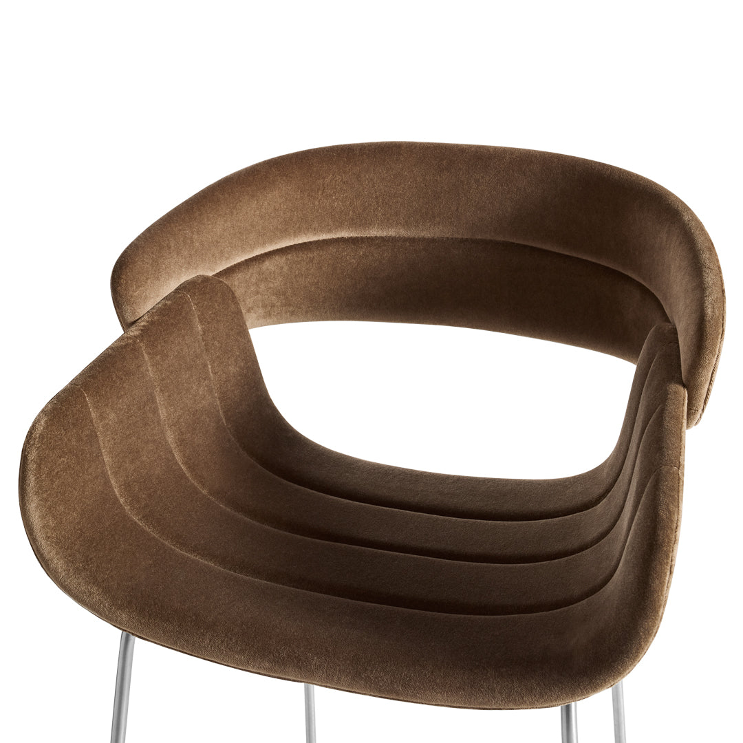 Brown upholstered chair with smooth, curved lines and a sleek, minimalist design. Perfect for modern interiors.