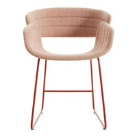 Peach textured fabric armchair with a sleek orange metal frame, featuring vertical ribbed patterns for a modern look.