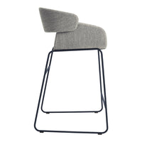 Gray upholstered bar stool with a modern design and a sleek black metal frame. Perfect blend of minimalist aesthetics.