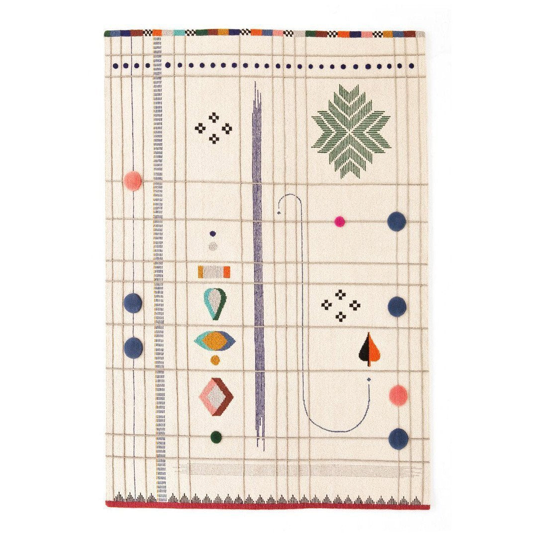 Colorful patterned textile with geometric designs, featuring green, pink, blue, and orange on a cream background.