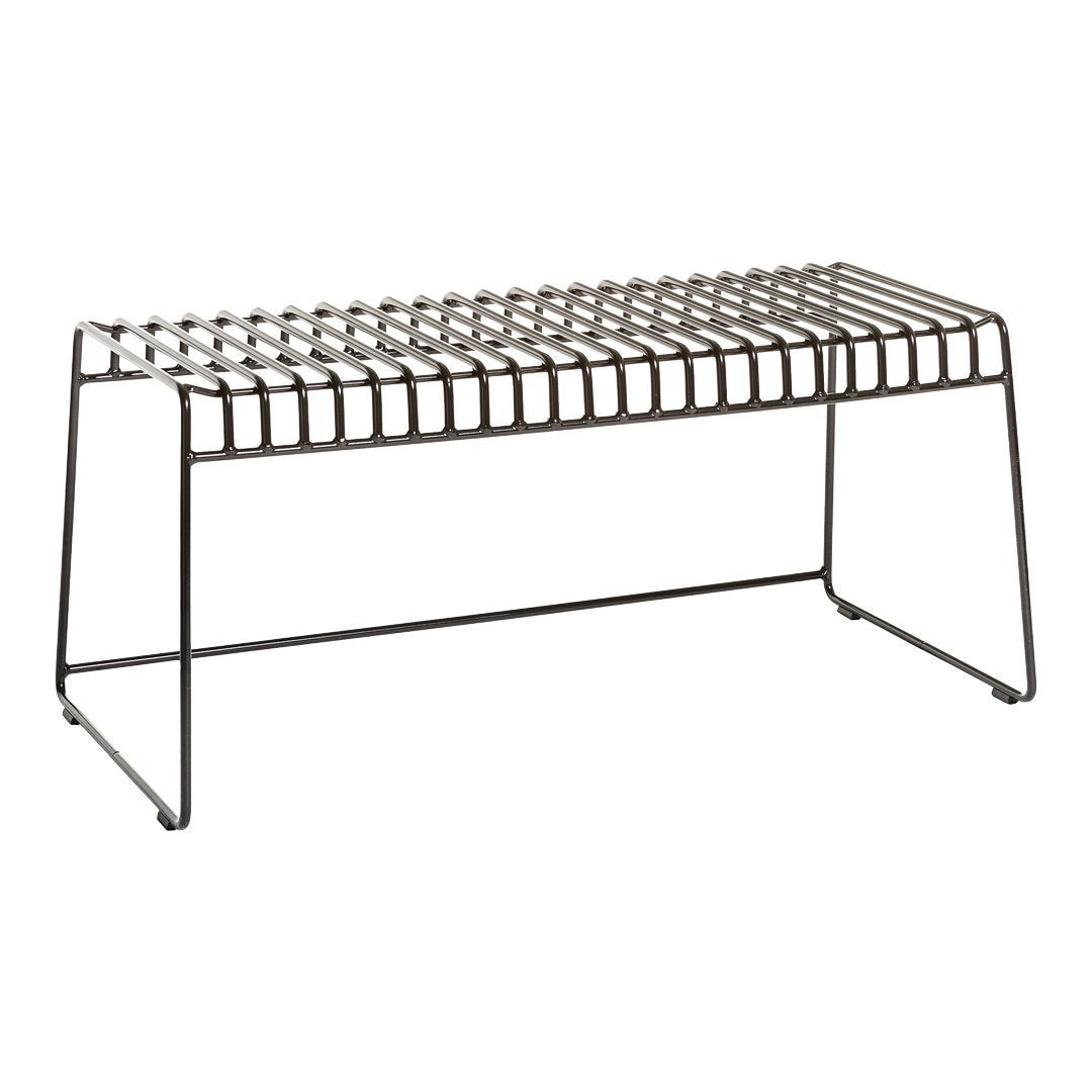 Black metal bench with a geometric striped pattern and sleek open design. Ideal for modern interiors.