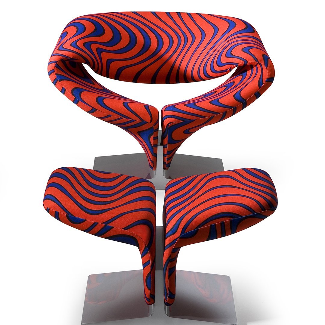 Red and blue abstract swirl patterned chair with a modern design. Perfect for adding a pop of color to any space.