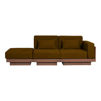 Brown velvet sofa with a minimalist design, featuring solid block colors and a smooth, luxurious texture.