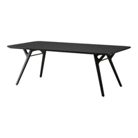 Sleek black dining table with a minimalist design and stylish, angled legs. Perfect for modern interiors.