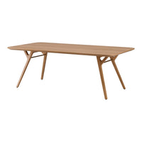 Light oak dining table with a smooth surface and sleek, minimalist design. Natural wood finish enhances modern decor.