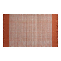 Rust-colored fringed rug with a textured, light orange background and solid dark orange borders.