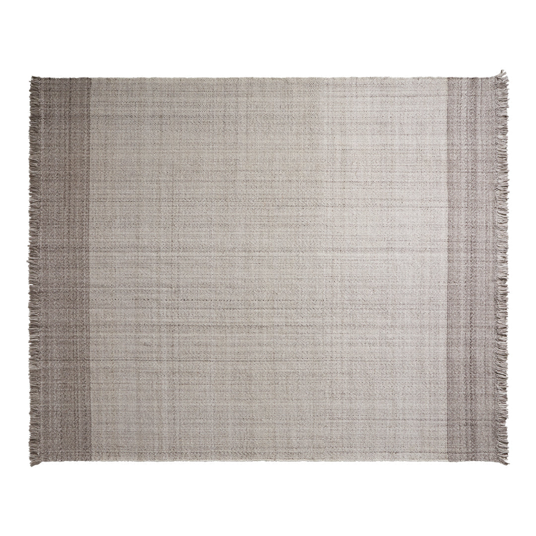 Light beige textured rug with subtle fringes and a classic woven pattern, perfect for softening any space.