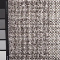 Light beige textured fabric with a subtle woven pattern, featuring varying shades of soft gray. Perfect for upholstery.