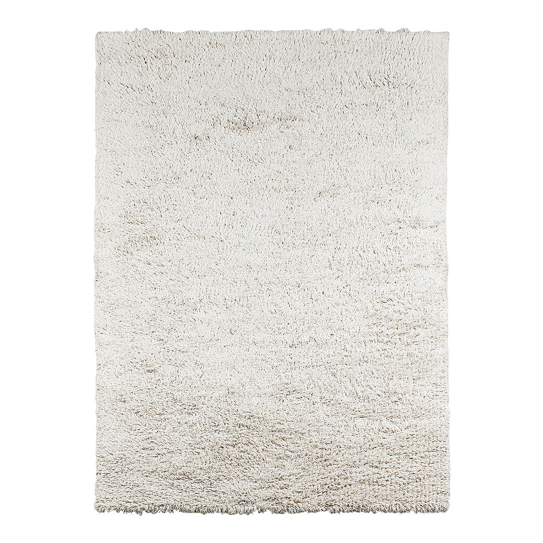 Soft, plush area rug in a cream hue with subtle texture, perfect for adding warmth to any space.