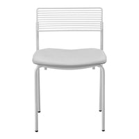 White metal chair with a modern striped backrest and a smooth, curved seat design in matching white.