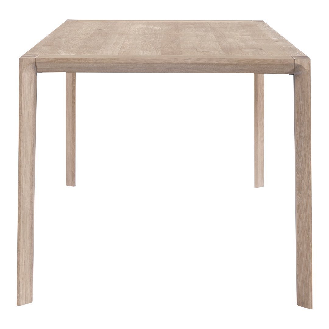 Light oak dining table with a smooth, natural wood grain pattern and minimalist design ideal for modern interiors.