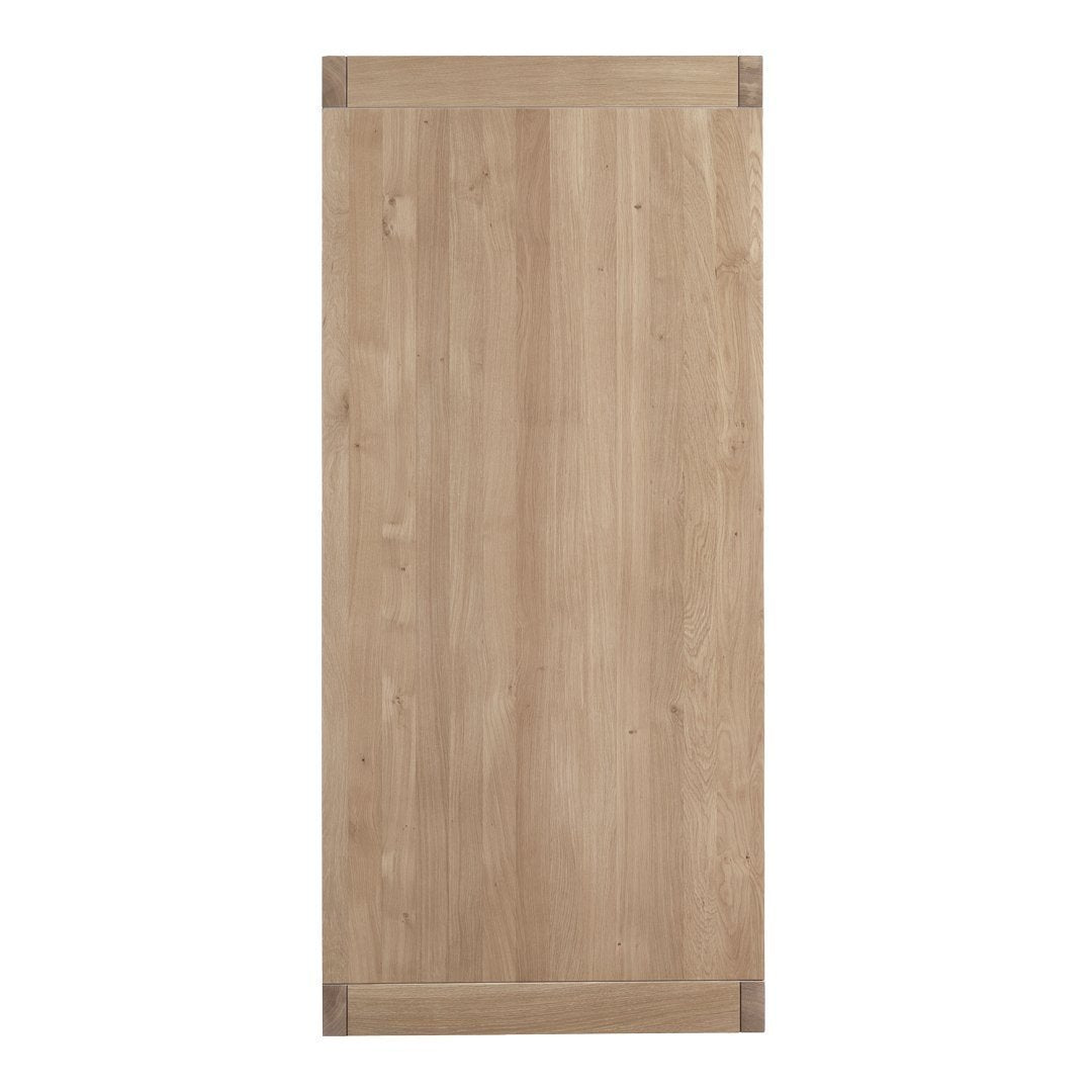 Wooden door with a light natural finish and subtle grain patterns, featuring contrasting corner accents.