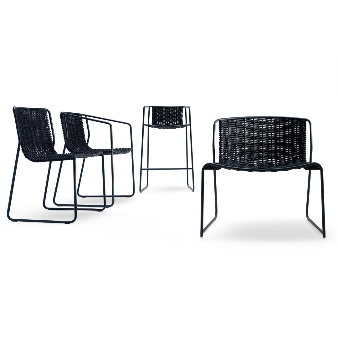 Set of four chairs in sleek black with a textured woven pattern, ideal for modern indoor or outdoor decor.