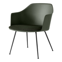 Green molded chair with a textured dark seat and sleek black legs, featuring a modern minimalist design.