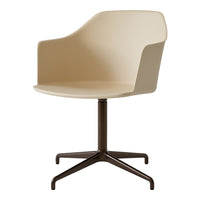Beige modern chair with a sleek design and brown matte metal base, perfect for any contemporary setting.