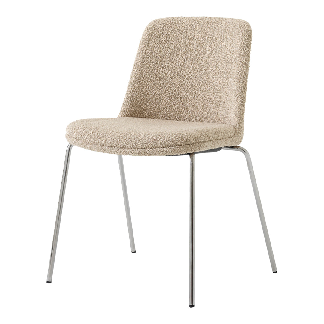 Beige upholstered chair with a textured pattern and chrome legs, adding modern elegance to any space.