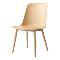 Beige chair with a smooth finish and natural wood legs, featuring a contemporary minimalist design.