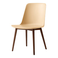 Beige chair with smooth, minimalist design and dark wooden legs, perfect for modern interiors.