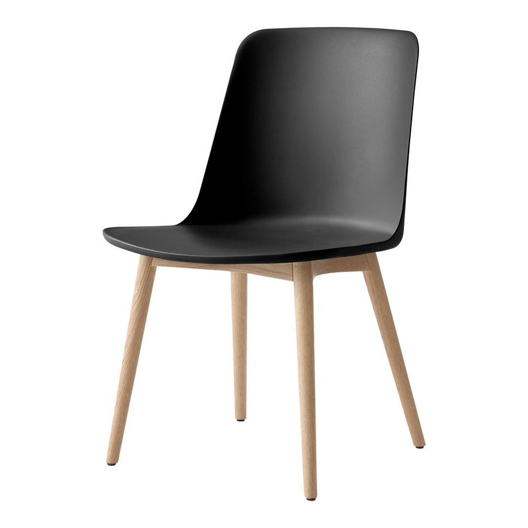 Black minimalist chair with smooth curves and natural wood legs, perfect for modern decor.