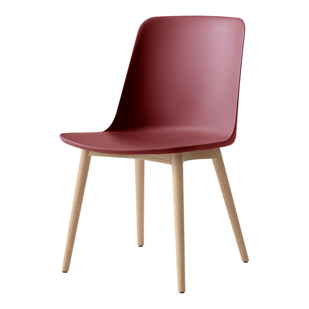 Modern burgundy chair with a smooth finish and natural wood legs, perfect for contemporary decor.