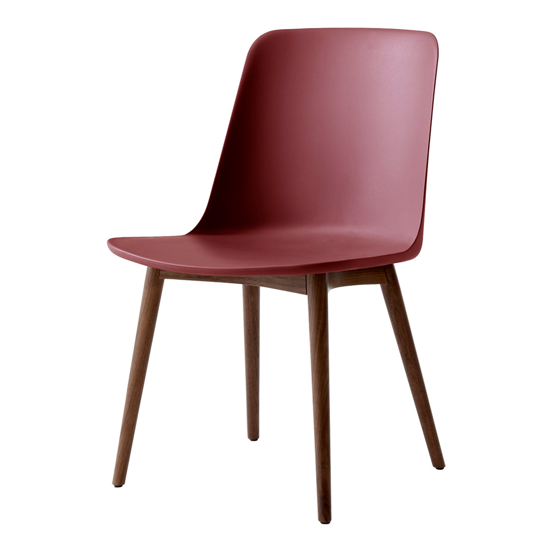 Stylish burgundy chair with a smooth finish and natural wooden legs, perfect for modern decor.