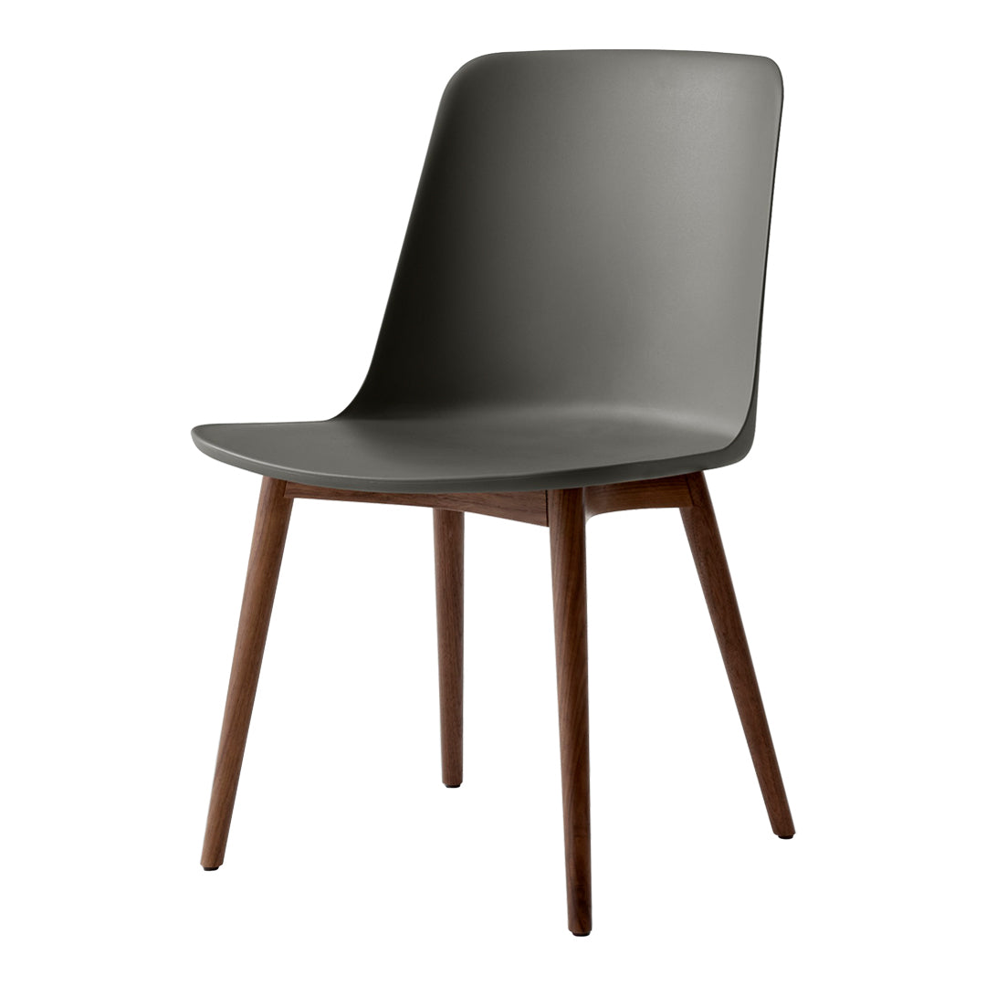 Gray plastic chair with a smooth finish and wooden legs, showcasing a minimalist design and modern aesthetic.