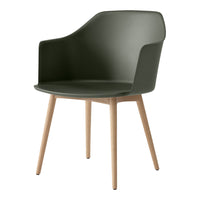 Olive green chair with smooth curves and light wooden legs, perfect for modern decor.