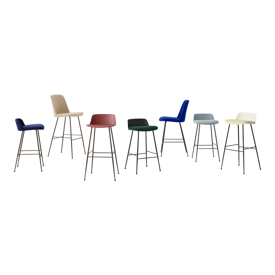 A vibrant collection of bar stools featuring various colors: navy, red, green, gray, beige, and cream, with sleek designs.