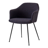 Stylish chair in a textured dark navy upholstery with black metal legs, perfect for modern decor.