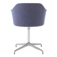 Back view of a modern chair featuring a textured lavender upholstery and a sleek silver base.
