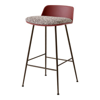 Red upholstered bar stool with a textured beige seat and a sleek dark metal frame. Ideal for modern decor.