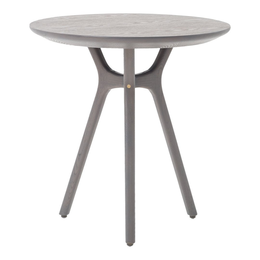 Gray round side table with a smooth surface and minimalist design, featuring three sleek legs for modern decor.