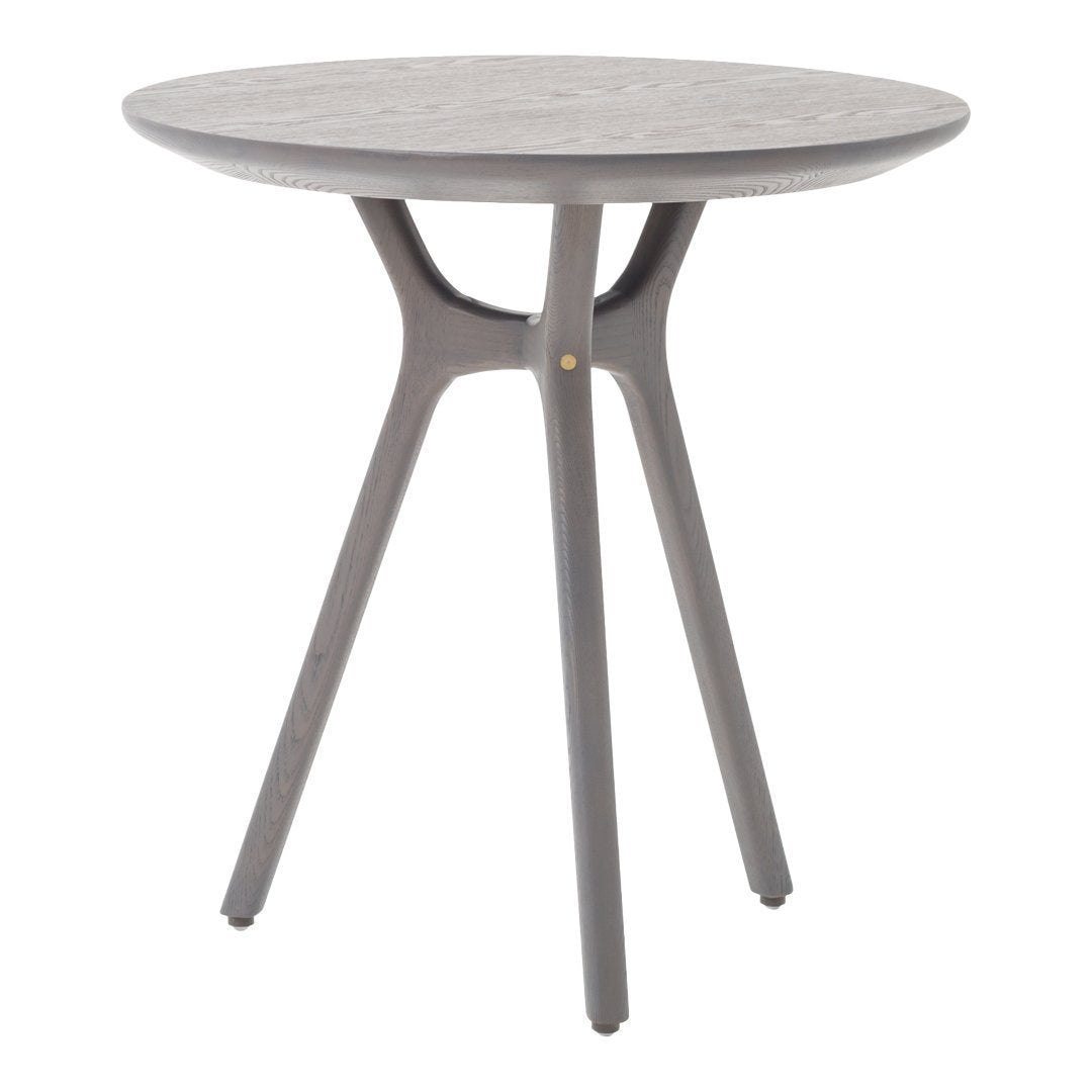 Gray round accent table with a textured surface and modern tripod legs, perfect for minimalist decor.