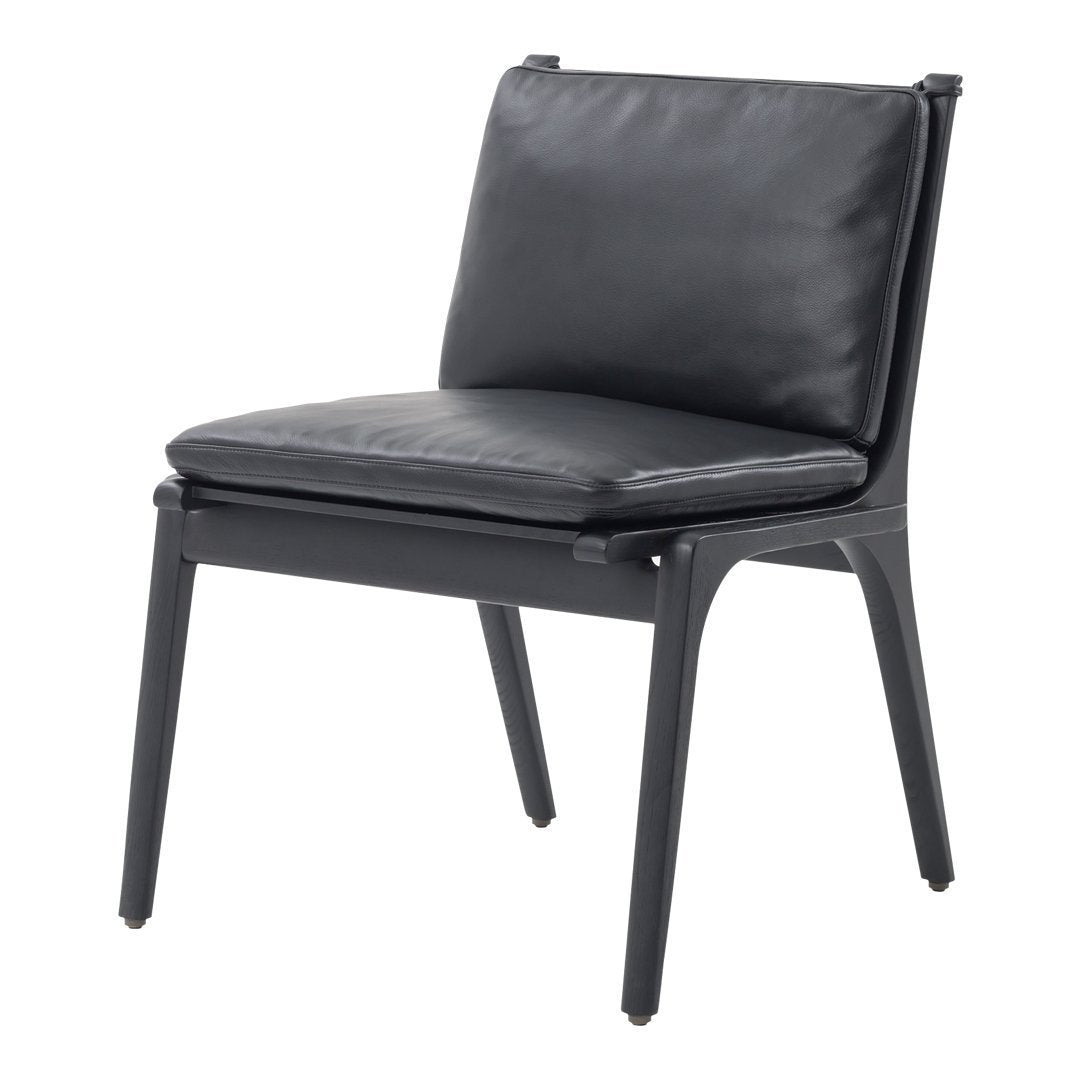 Black leather lounge chair with sleek lines and smooth finish, featuring a minimalist design and modern appeal.