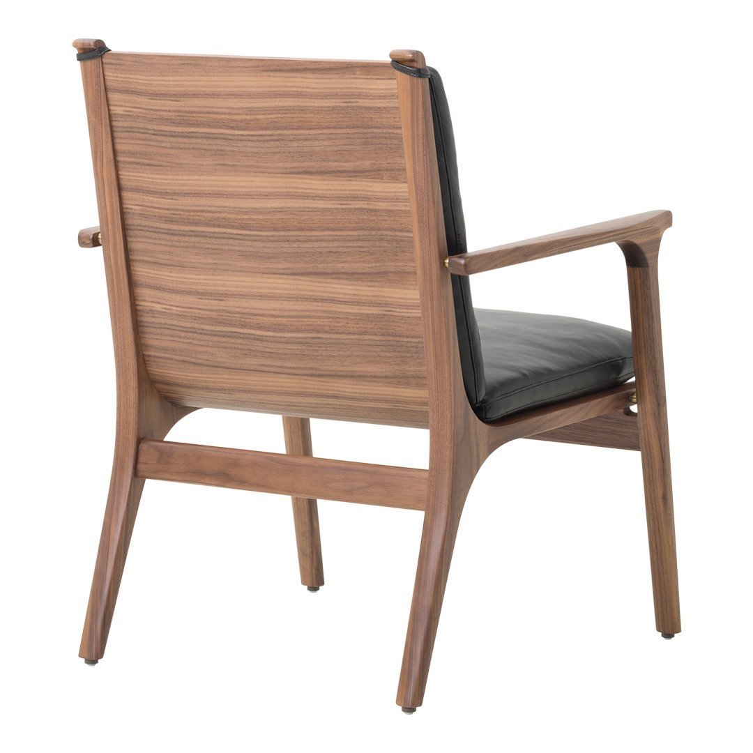 "Back view of a sleek wooden chair in walnut finish with a black leather cushion, showcasing a modern and stylish design."