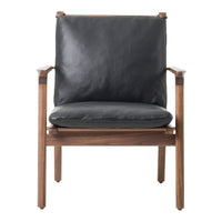 "Elegant black leather armchair with a warm wood frame, featuring a minimalist design and smooth patterns."