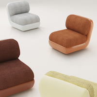 Colorful modern chairs in gray, white, brown, orange, and light yellow fabric with varied textures and patterns.
