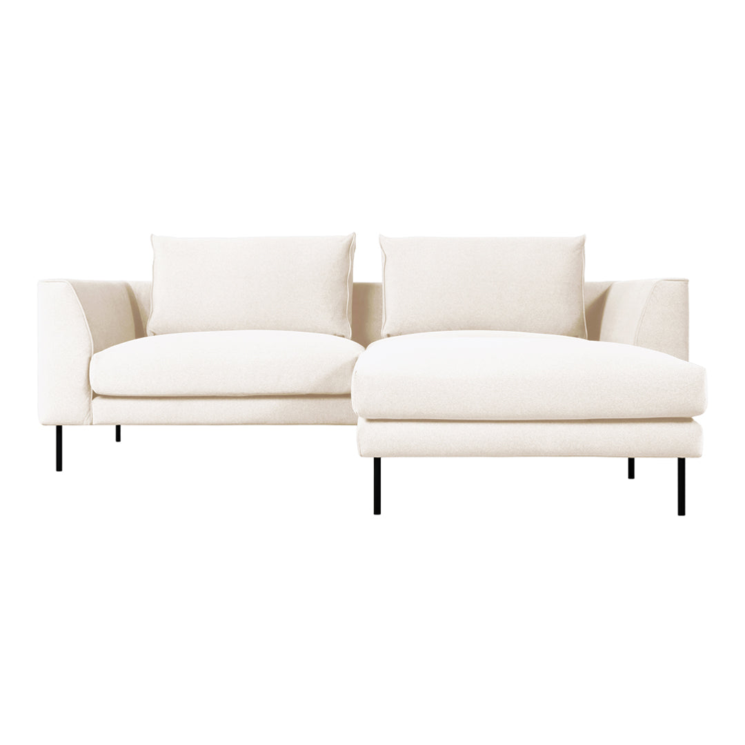 Modern cream sofa with plush cushions and sleek black legs, featuring a minimalist, elegant design.