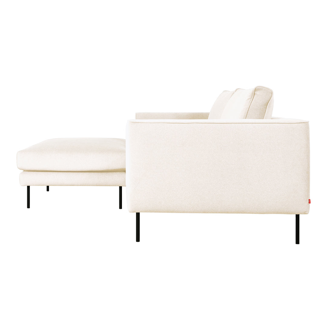 Modern cream sofa with a sleek design, featuring a solid black metal frame and no visible patterns.