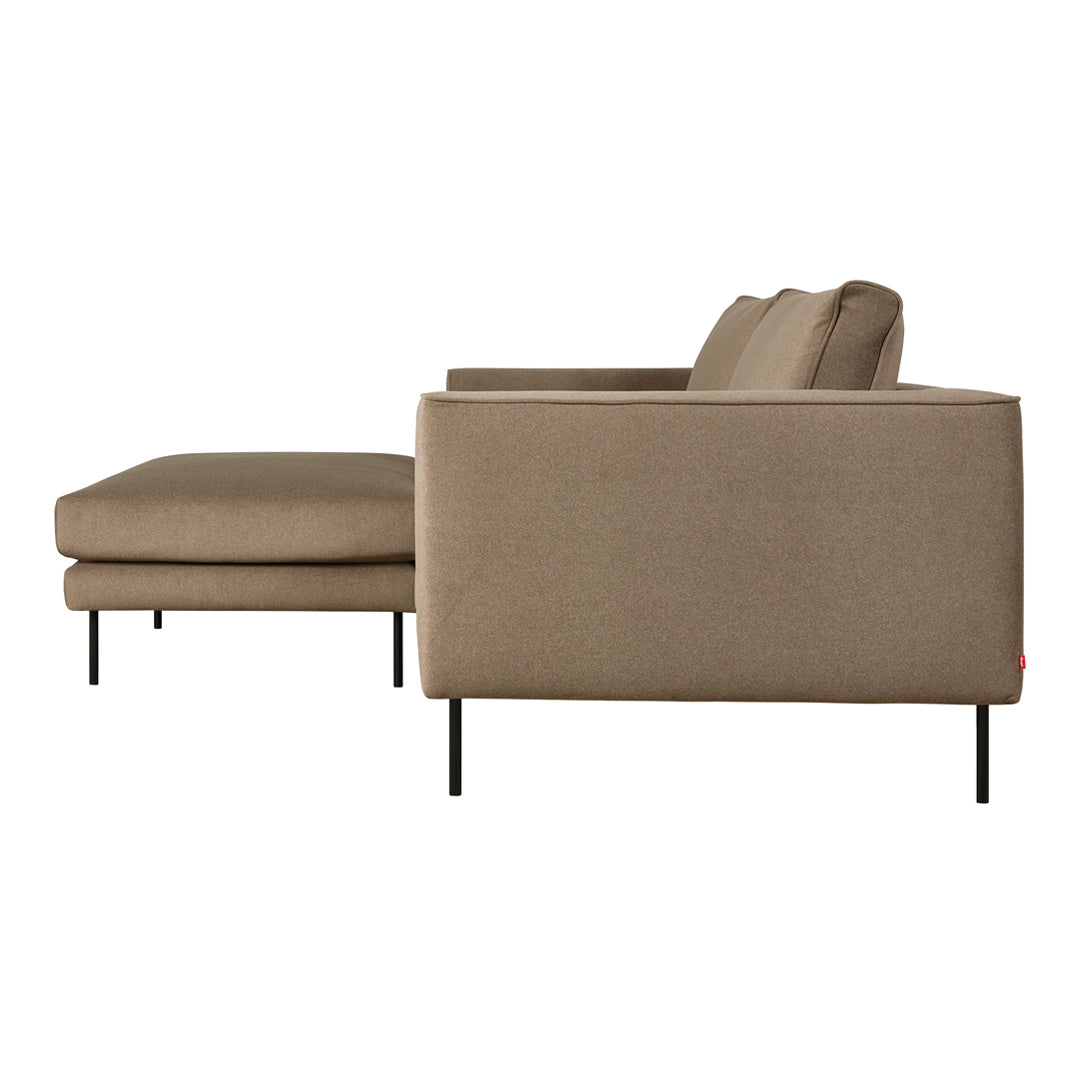 Modern beige sofa with sleek lines and a minimalist design, featuring subtle texture and contrasting black legs.