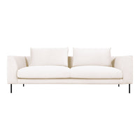 Elegant beige sofa with soft, textured upholstery and minimalist design, featuring clean lines and neutral colors.