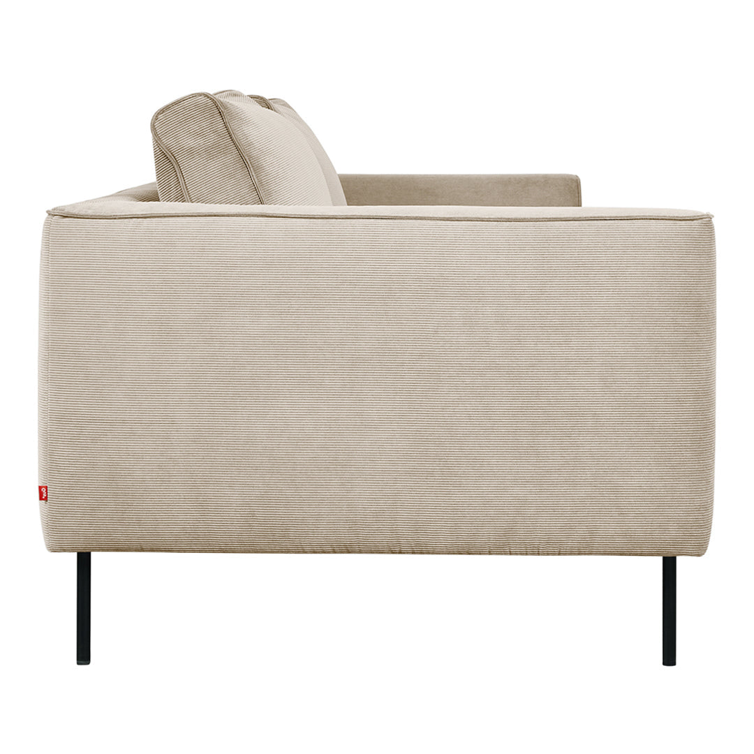 Beige fabric sofa with a minimalist design and sleek black metal legs, showcasing a clean, modern aesthetic.