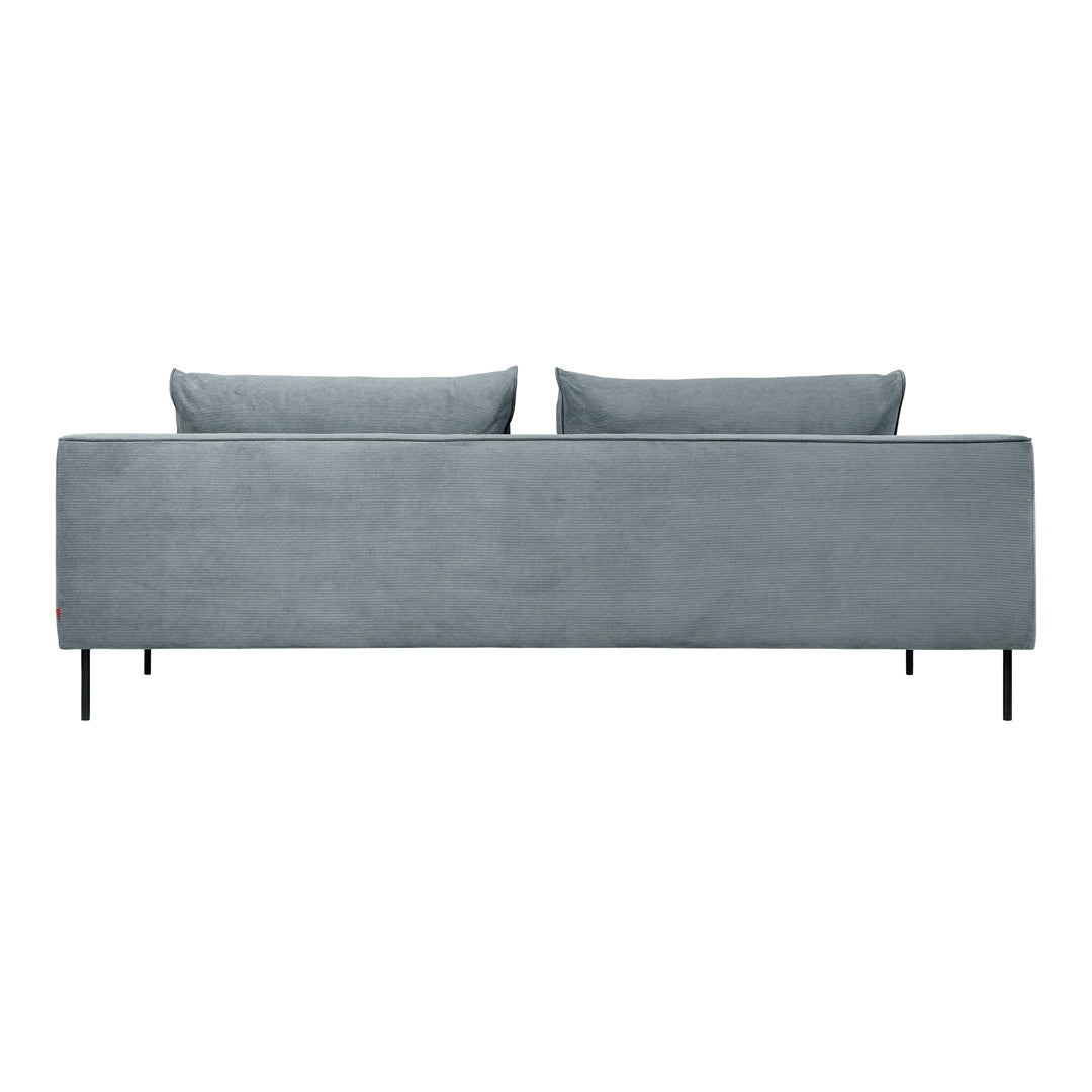 Soft blue velvet sofa with smooth, solid pattern and two matching cushions; sleek black metal legs.